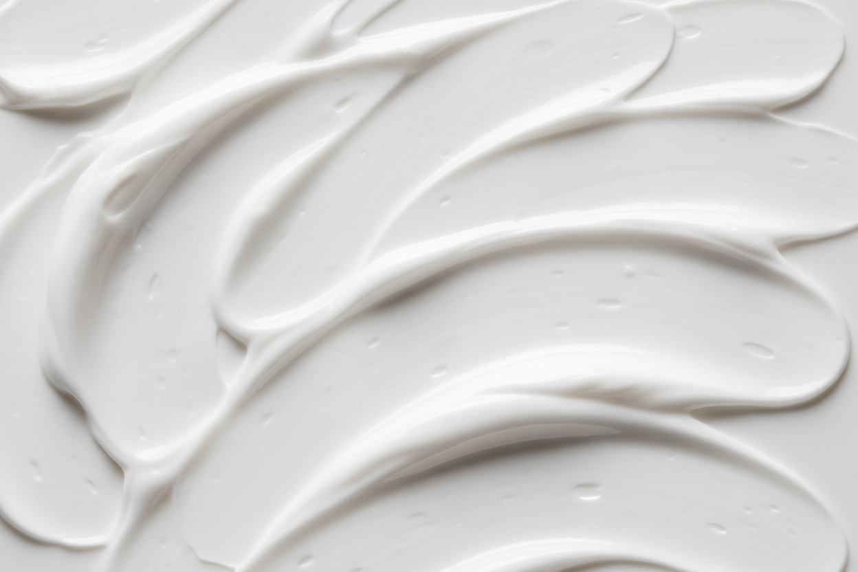 face cream spread over white background.. close up